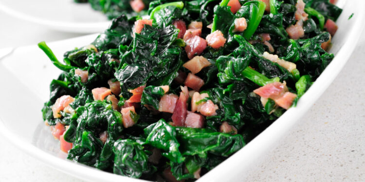 closeup of a bowl with spanish espinacas con jamon, spinach with ham